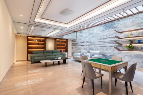 a conference room with a table and chairs at Sanya Haitang Bay Muyu Time Seaview Apartment in Sanya