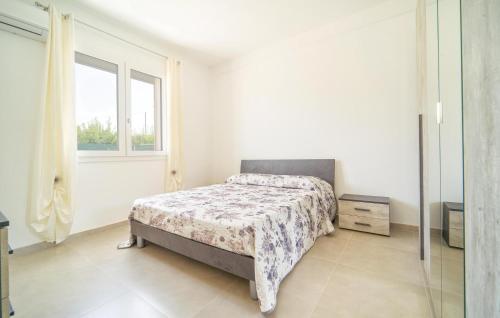 a bedroom with a bed and a window at Da Za Dichina in Realmonte