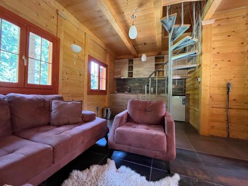 a living room with a couch and two chairs at Tvoja Kućica Za Beg in Banjska