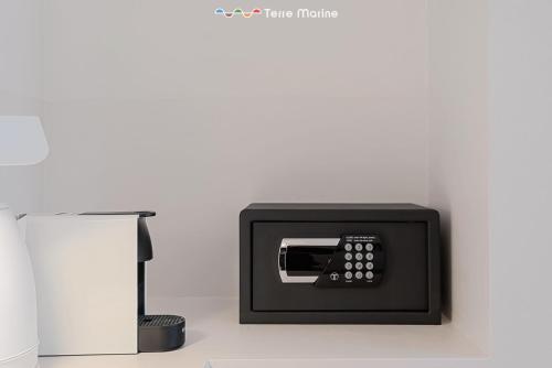 a pay phone on a wall next to a lamp at Affittacamere Isabella, Terre Marine in Levanto