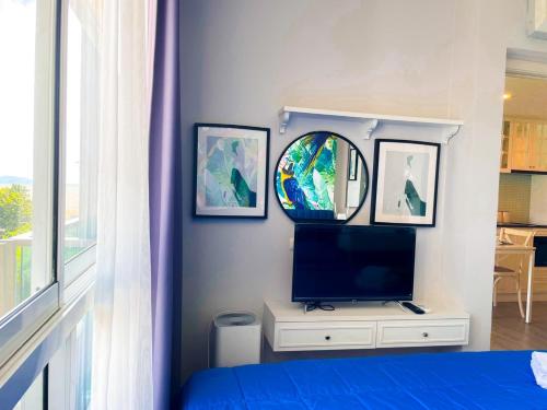 Exclusive condo & Seaviewにあるテレビまたはエンターテインメントセンター