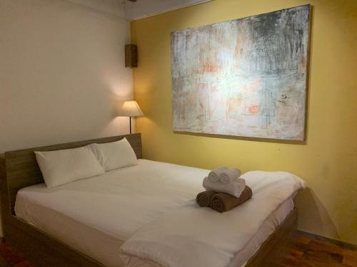 a bedroom with a bed with a stuffed animal on it at Eco Lagoon in Phu Quoc
