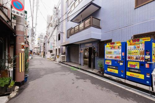 an empty street in an asian city with buildings at Super close to Dotonbori! Great location room#403 in Osaka