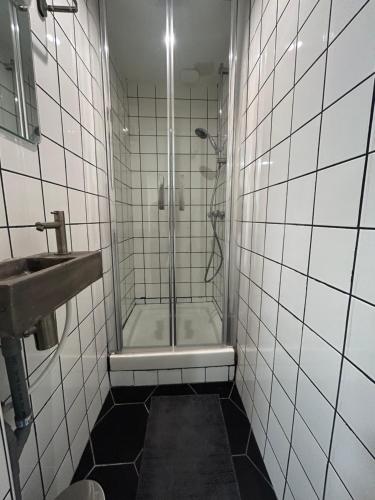 a bathroom with a shower and a sink at Liberte 2 in Marseille