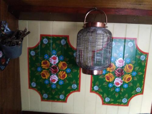 a chandelier hanging from a wall with two windows at Rosie and Jim Retreat with hot tub indoors amazing in Lincoln