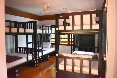 a room with four bunk beds in a room at Blanco Hideout Railay - Youth Hostel 18 to 35 Only in Railay Beach