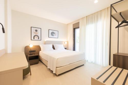 Postel nebo postele na pokoji v ubytování Palm View Suites