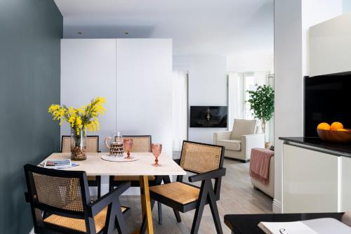 a dining room with a table and chairs at Apartamentos Sevilla Centro in Seville