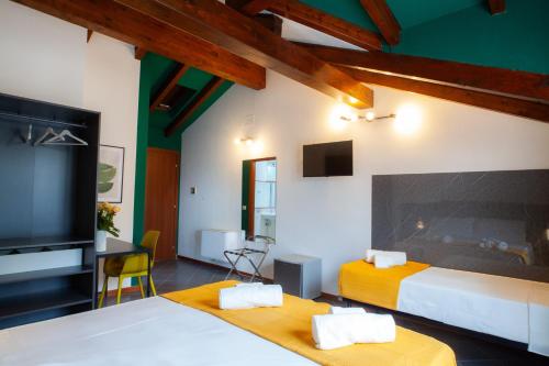 Postel nebo postele na pokoji v ubytování RRRapido Hotel