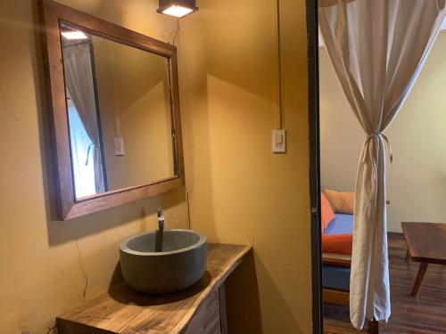a bathroom with a sink and a mirror at Eco Lagoon in Phu Quoc