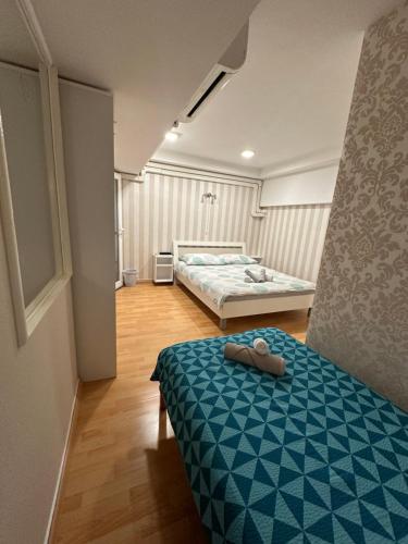 Postel nebo postele na pokoji v ubytování Granada Rooms