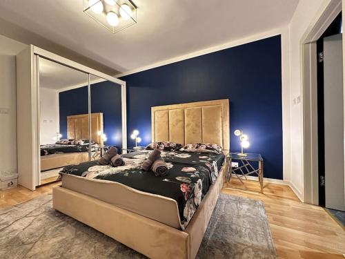 a large bedroom with a large bed with a large mirror at Sunshine Apt in Central Sliema in Sliema