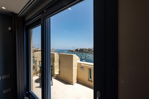 a view of the ocean from a window at Casa Rosanna Malta B&B Adults only 16 plus in Marsaskala