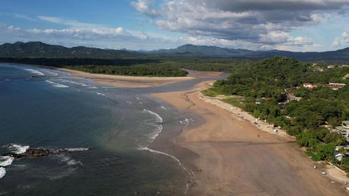 an aerial view of a beach and the ocean at Casa Brisas Del Mar- Luxury 6 Bedroom Ocean View Home in Puerto Viejo