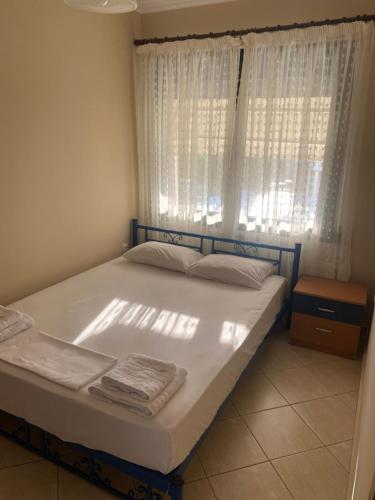 Ένα ή περισσότερα κρεβάτια σε δωμάτιο στο Enjoy Ofrinio Apartment