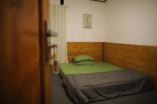 Giường trong phòng chung tại Mama Tia Family Homestay