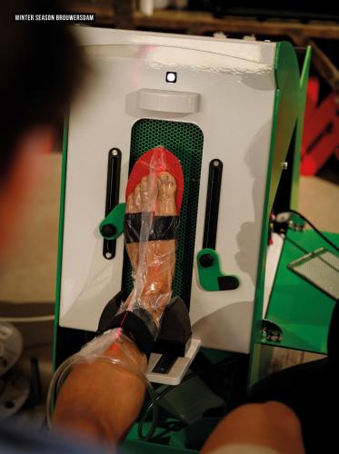 a persons feet in a box with a doll in it at Brouwersdam Stay in Ouddorp