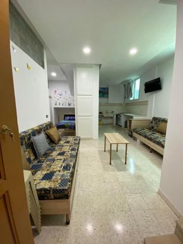 Μια τηλεόραση ή/και κέντρο ψυχαγωγίας στο Appartement S1 pieds dans l'eau