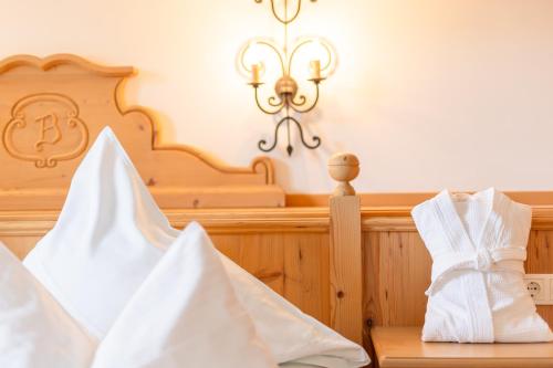 a room with a church with a crib and a chandelier at Hotel Berghof in Neustift im Stubaital