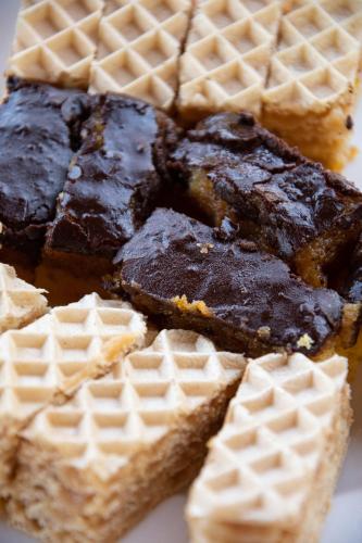 a plate of waffles with chocolate pudding and waffle at Imanje Lotus Garden in Šabac