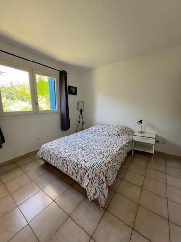 En eller flere senge i et værelse på Appartement T3 grand jardin