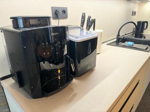 a coffee maker sitting on top of a counter at Apartmán I2 in Hrabušice