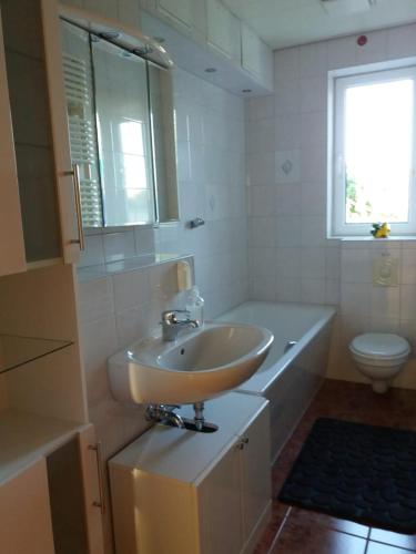 a bathroom with a sink and a toilet at Sonnenschein in Neustrelitz