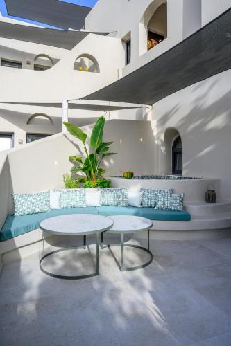 a room with a table and a bench at Galaria Serenity Suites in Vóthon