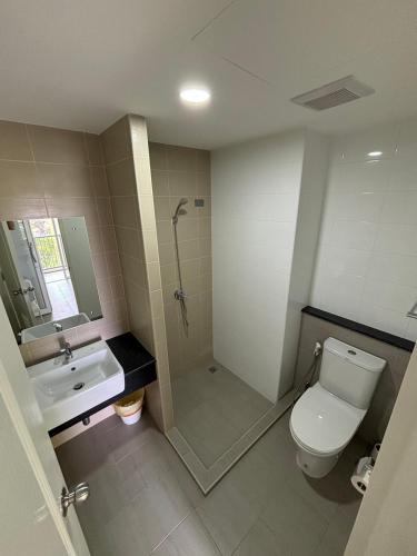 a bathroom with a shower and a toilet and a sink at Maesod Mountain View in Mae Sot