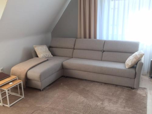 a living room with a couch and a table at fewo-friends in Reinfeld