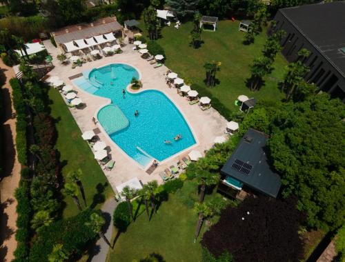 an overhead view of a swimming pool in a resort at Astoria Resort in Riva del Garda