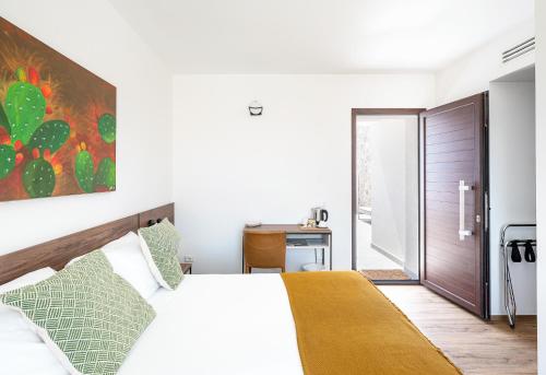 Ένα ή περισσότερα κρεβάτια σε δωμάτιο στο Elaia Rooms