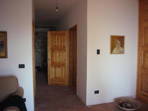 a hallway with a door and a door to a room at Vila Amantia in Vlorë