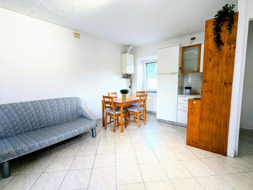 a living room with a couch and a table at Fontana House in Domodossola