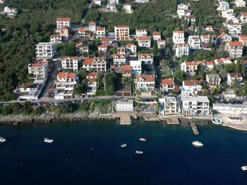 an aerial view of a town with boats in the water at Apartments Montevibe in Tivat