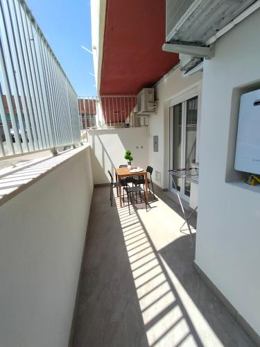 a balcony with a table and a tv on a building at Sabbia di Mare in Termoli