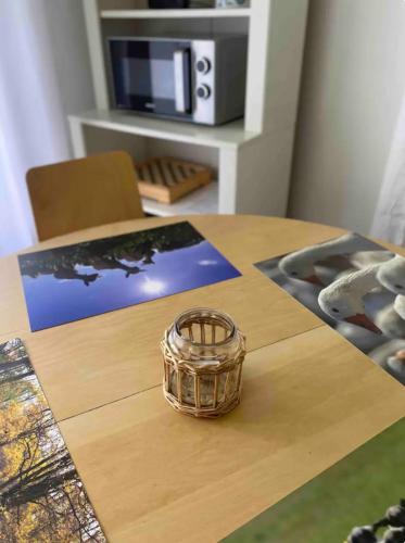 a basket sitting on top of a wooden table at Cosy cottage with wellness in Mirošovice