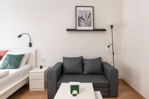 a living room with a couch and a table at U Mamlasů in Brno