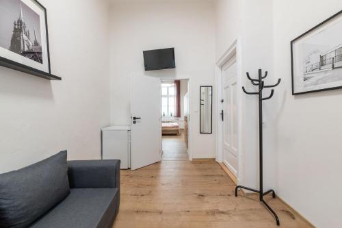 a living room with a couch and a tv at U Mamlasů in Brno