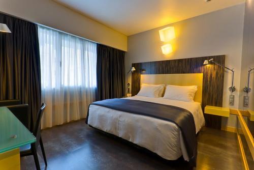 Postel nebo postele na pokoji v ubytování Hotel Alif Avenidas