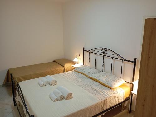 Postel nebo postele na pokoji v ubytování Borgo Family Suite