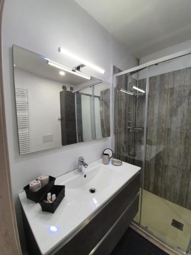 a white bathroom with a sink and a shower at Bergamo - La Casa Di Gianna in Nembro