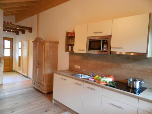 a kitchen with a sink and a counter top at Haus Schwaiger in Bad Hofgastein