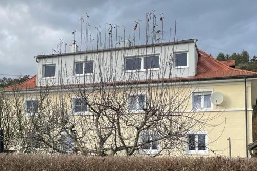 a large building with antennas on top of it at Stadtmitte mit Schlossblick in Sigmaringen