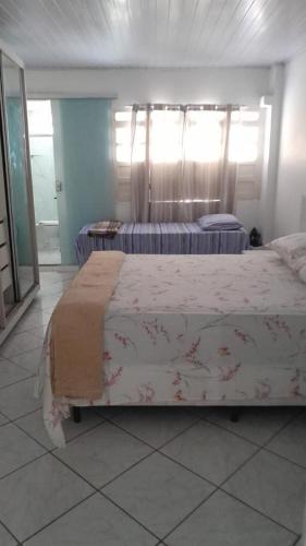a bedroom with two beds in a room at Blue House in Lençóis