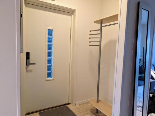 a door in a room with a window at Green appartement in Sandnes