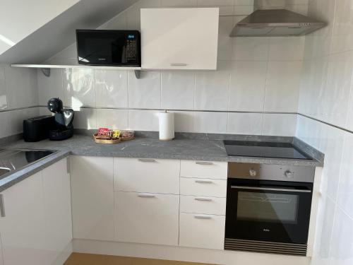 Dapur atau dapur kecil di APARTAMENTO MARISMAS DA LANZADA- Playa de La Lanzada