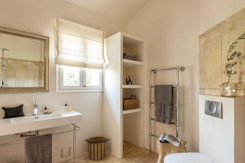 a bathroom with a sink and a shower at La Bergerie in Bargemon