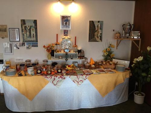 a table with a table cloth with food on it at Hotel Del Sol in Bad Wildungen