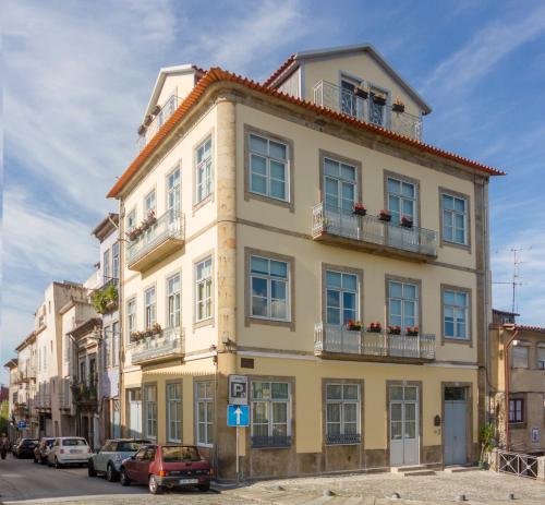 
a large building with a large window on the side of it at Domus 26 Guesthouse - B&B in Braga
